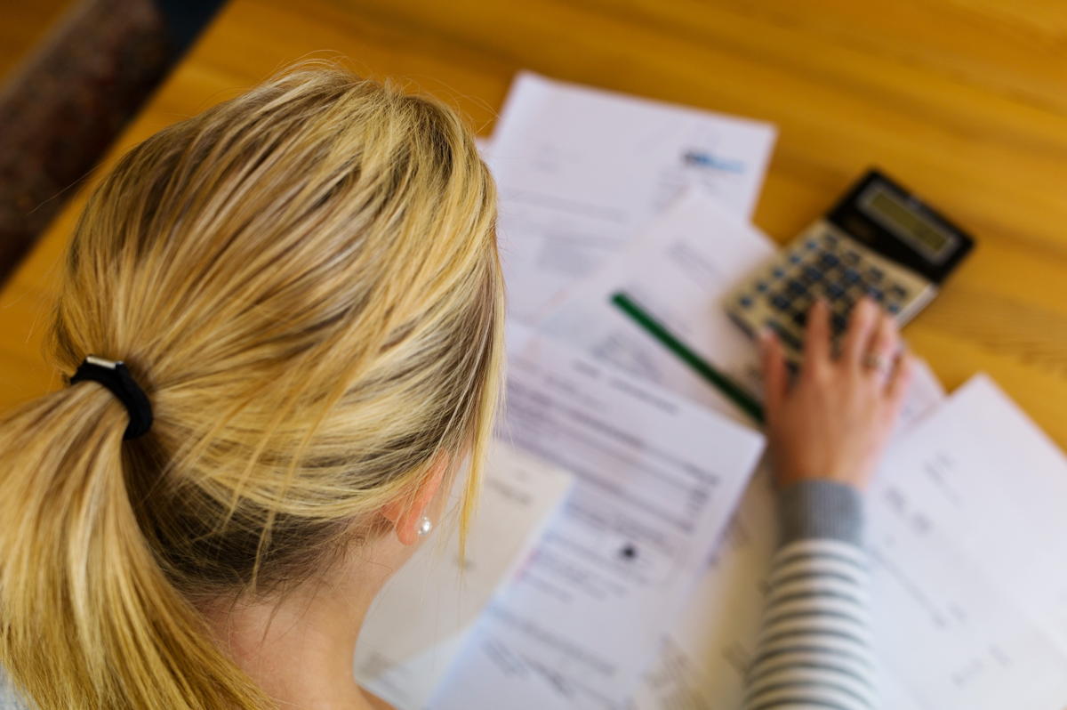 a woman with unpaid bills has many debts. unemployment and personal bankruptcy